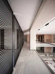 Modern living space with marble flooring and linear wall panels.