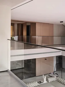 Modern residential hallway featuring a sleek, clean design with composite wood laminate flooring.