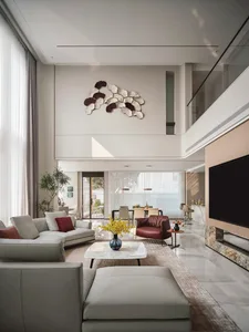 A modern living room with a marble floor, leather furniture, and a contemporary chandelier.