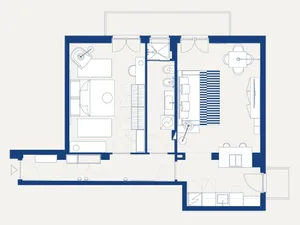 A minimalist residential floor plan featuring a living area with a striped sofa, a bedroom, a bathroom, and a kitchen area.