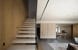Modern interior space with glass and wood elements.