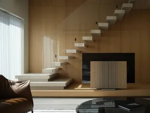 Modern living room featuring a wooden staircase and a glass coffee table.