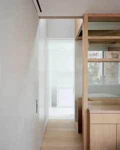 Minimalist interior design featuring wooden elements.