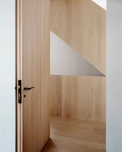 Modern minimalist interior design with a paneled wooden wall