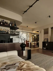 A minimalist living room with neutral-colored furniture and decor.