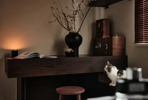 A modern living room with wooden walls and a comfortable seating area.