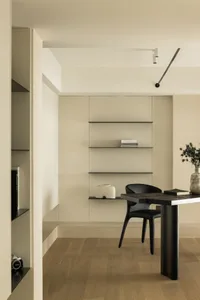 Modern desk space featuring wooden furniture and minimalist design elements.