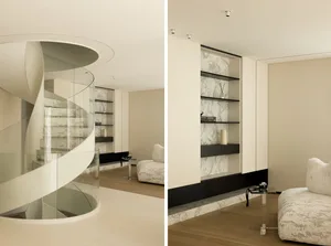Modern residential interior featuring a spiral staircase and a built-in shelving unit with marble accents.