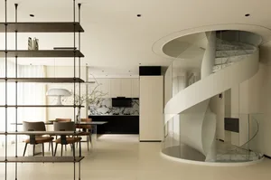 Modern minimalist kitchen featuring stone countertops and columns.
