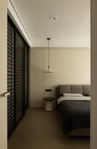 A minimalist bedroom in neutral tones with a modern design.