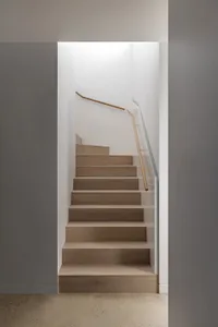 A minimalist staircase made of wood.