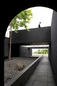 A modern architectural space featuring concrete material and a minimalist design.