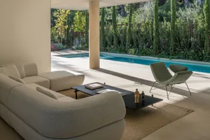 A modern living room featuring contemporary furniture and minimalist design elements.