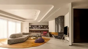 Modern living room with marble accents and wooden flooring
