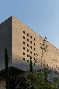 Concrete building facade with a pattern of rectangular openings
