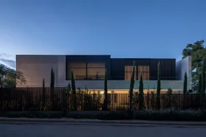 A modern residential house featuring metal-clad exterior.