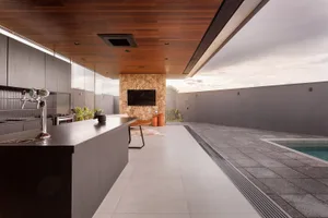 Modern residential space featuring concrete flooring and a contemporary design.