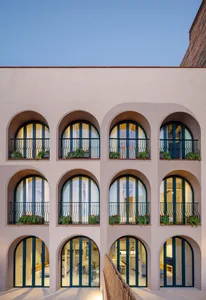 Architectural view of a modern residential complex featuring geometric concrete architecture.