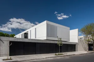 Modern house exterior with a concrete facade and geometric design elements