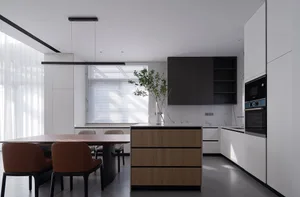 Modern kitchen with granite countertops and wooden cabinets.