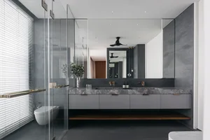 Modern bathroom with marble countertop and concrete flooring
