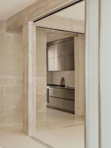 A modern house with a minimalist design featuring concrete walls and floors.
