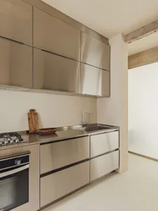 Modern kitchen featuring metallic materials and minimalist design