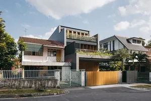 Modern residential house exterior with concrete and glass features