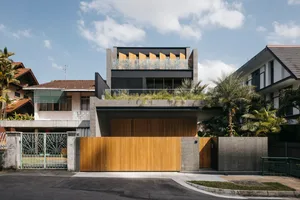 A modern residential exterior with wooden and concrete materials.