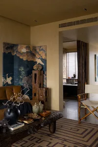 A minimalist living room with wooden furniture and decor.
