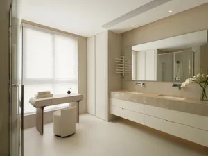 Modern bedroom featuring minimalist design with concrete walls and white furniture.