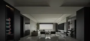 Modern apartment interior featuring minimalist furniture and concrete walls.