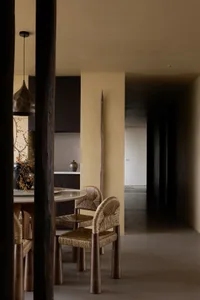 Modern dining room featuring wooden furniture and minimalist decor.