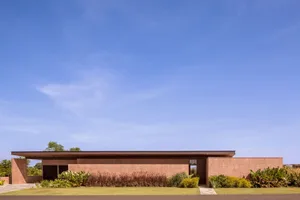 Modern house exterior featuring clay-stone render