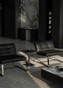 Modern living room with black leather furniture on a gray carpet, metal table, and marble accents.