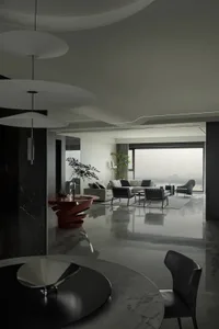 Modern minimalist living room featuring marble accents and a sleek, contemporary design.