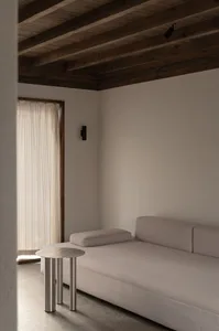 Minimalist, neutral-tones sofa in an office setting
