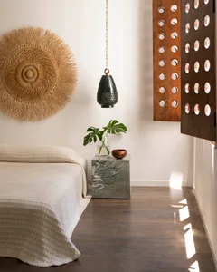 A minimalist bedroom featuring wooden textures and a natural wood finish.