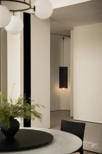 A minimalist space with modern lighting fixtures.
