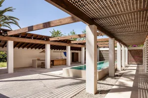Modern outdoor living space with concrete and wood elements.