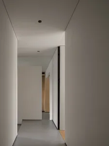 A minimalist white interior with clean lines and open space.