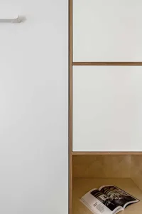 A minimalist bookshelf made of walnut wood.