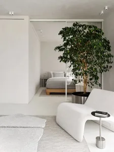 Minimalist bedroom with metal, glass, and wood elements