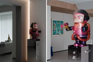 A modern apartment featuring a plastic figurine on a metallic cabinet.