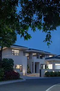 Modern residential architecture featuring concrete and glass materials.