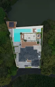 Aerial view of a modern residential floor plan featuring a pool, outdoor seating, and a rooftop terrace.