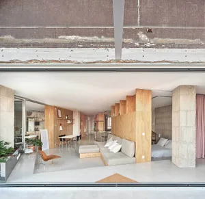 Modern living room featuring concrete and wooden elements.