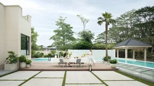 An outdoor living space featuring modern design elements with concrete, wood, metal, and glass materials.