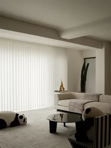 A modern living room with textured fabrics, a sofa, and a coffee table.