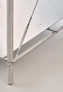 Modern metal table with structural components and cables